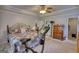 Bedroom features large bed, exercise equipment, and neutral wall paint at 1130 Rawlings Dr, Rutledge, GA 30663