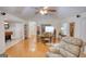 Bright dining room features hardwood floors, vaulted ceilings, and classic wooden furniture with seating for six at 1130 Rawlings Dr, Rutledge, GA 30663