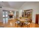 Dining area with hardwood floors, a wooden table with seating for six, and built-in wooden hutch storage at 1130 Rawlings Dr, Rutledge, GA 30663