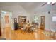 Cozy dining room with hardwood floors, a classic wooden table and decor, and ample natural light at 1130 Rawlings Dr, Rutledge, GA 30663