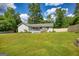 Charming single-story home with a well-manicured lawn and inviting front porch at 1130 Rawlings Dr, Rutledge, GA 30663