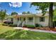 Charming home features a well-manicured lawn, an inviting porch, and delightful landscaping for great curb appeal at 1130 Rawlings Dr, Rutledge, GA 30663