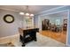 Kitchen featuring an island with an attached table and an open view of the adjacent dining area at 1130 Rawlings Dr, Rutledge, GA 30663