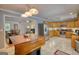 Spacious kitchen featuring stainless steel appliances, a large island, and an open view to the living space at 1130 Rawlings Dr, Rutledge, GA 30663