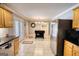 Kitchen with stainless steel appliances, custom cabinets, tiled floors, and granite countertops at 1130 Rawlings Dr, Rutledge, GA 30663