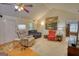 Living room with vaulted ceiling, ceiling fan, carpet and hardwood floors, and plentiful comfortable seating at 1130 Rawlings Dr, Rutledge, GA 30663