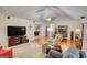 Open living room flowing into dining area with hardwood floors and plush seating at 1130 Rawlings Dr, Rutledge, GA 30663