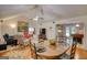 Open floor plan features a dining area, living room, hardwood floors, and comfortable seating at 1130 Rawlings Dr, Rutledge, GA 30663