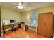 Office space with wood floors, two desks, and wooden wardrobe at 1130 Rawlings Dr, Rutledge, GA 30663