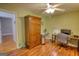 Office space featuring wood floors, a wooden wardrobe, and desk at 1130 Rawlings Dr, Rutledge, GA 30663