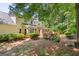 A spacious backyard featuring a wooden deck and lush landscaping at 1850 Linnet Ne Ct, Roswell, GA 30075