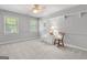 Calm bedroom featuring rocking chair, accent chair, and soft, neutral carpet at 1850 Linnet Ne Ct, Roswell, GA 30075