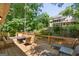 Spacious wooden deck with outdoor seating and a view of the lush backyard at 1850 Linnet Ne Ct, Roswell, GA 30075