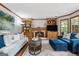 Cozy living room with a fireplace, built-in shelves, and comfortable seating arrangement at 1850 Linnet Ne Ct, Roswell, GA 30075