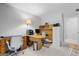 Home office featuring a wooden desk, filing cabinet, and neutral carpet at 1850 Linnet Ne Ct, Roswell, GA 30075
