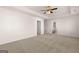 Spacious bedroom with carpet floors, ceiling fan and access to bathroom at 173 Aster Ave, Locust Grove, GA 30248