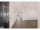 Entryway with hardwood floors and access to the living room at 173 Aster Ave, Locust Grove, GA 30248