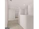 Second floor hallway with carpet and white walls leads to the bedrooms at 173 Aster Ave, Locust Grove, GA 30248