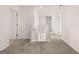 Upstairs hallway with neutral carpet, white walls, and doors leading to rooms at 173 Aster Ave, Locust Grove, GA 30248