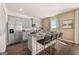 Modern kitchen island with seating, stainless appliances, and ample counter space at 173 Aster Ave, Locust Grove, GA 30248