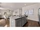 Open kitchen layout with a large island, perfect for meal preparation and casual dining at 173 Aster Ave, Locust Grove, GA 30248