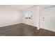 Bright living room featuring hardwood floors and a large window at 173 Aster Ave, Locust Grove, GA 30248