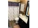Cozy bathroom with a wood accent wall and modern decor at 5814 Highgrove Dr, Atlanta, GA 30349