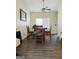This dining room features dark hardwood floors and an elegant ceiling fan at 5814 Highgrove Dr, Atlanta, GA 30349