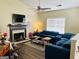 Spacious living room with vaulted ceilings, fireplace, and a large blue sectional couch at 5814 Highgrove Dr, Atlanta, GA 30349