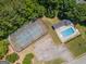 Aerial view showcasing tennis court and community swimming pool at 832 Windy Mill Ct, Temple, GA 30179