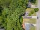 Aerial view of a home surrounded by lush trees and well-manicured lawns at 832 Windy Mill Ct, Temple, GA 30179