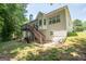 Large backyard view showing a spacious deck with stairs, ideal for outdoor gatherings at 832 Windy Mill Ct, Temple, GA 30179