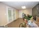 Versatile basement space with access to the yard through white-framed glass doors at 832 Windy Mill Ct, Temple, GA 30179