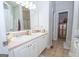 Bright bathroom with a double vanity, tile floors, and neutral tones, offering a serene and functional space at 832 Windy Mill Ct, Temple, GA 30179