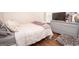 This is a cozy bedroom with hardwood floors and a gray dresser at 832 Windy Mill Ct, Temple, GA 30179