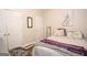 Neutral bedroom with two white doors, gray accents, and a positive affirmation blanket at 832 Windy Mill Ct, Temple, GA 30179