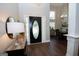 Welcoming foyer with hardwood floors, high ceilings, and elegant lighting fixtures at 832 Windy Mill Ct, Temple, GA 30179