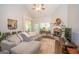 Spacious living room featuring vaulted ceilings, a cozy fireplace, and hardwood flooring at 832 Windy Mill Ct, Temple, GA 30179