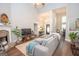 Spacious living area featuring hardwood floors, fireplace, and a view of the front entry at 832 Windy Mill Ct, Temple, GA 30179