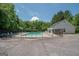 Community pool surrounded by a fence and featuring lounge chairs at 832 Windy Mill Ct, Temple, GA 30179