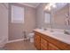 Bathroom featuring double vanity and shower/tub combo at 8321 Banks Mill Rd, Douglasville, GA 30135