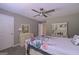 Bedroom featuring neutral tones, ceiling fan, and walk-in closet at 8321 Banks Mill Rd, Douglasville, GA 30135