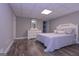 This bedroom features wood floors and a mirror above the dresser at 8321 Banks Mill Rd, Douglasville, GA 30135