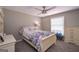 Bedroom with ceiling fan, neutral walls, and large window at 8321 Banks Mill Rd, Douglasville, GA 30135