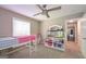 Bedroom featuring ceiling fan, window and playful decor at 8321 Banks Mill Rd, Douglasville, GA 30135