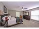 Bedroom featuring large bed, carpet and good natural light at 8321 Banks Mill Rd, Douglasville, GA 30135