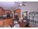 Eat-in kitchen with hardwood cabinets and granite counters with an adjacent dining table set for four at 8321 Banks Mill Rd, Douglasville, GA 30135