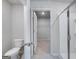 Bathroom with toilet and shower stall, and an open door to the walk-in closet at 609 Lobelia Way, Locust Grove, GA 30248