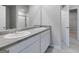 Bathroom with double sink vanity, spacious countertop, and access to the walk-in closet at 609 Lobelia Way, Locust Grove, GA 30248
