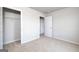 Bedroom featuring neutral carpet, white walls, and a closet with wire shelving at 609 Lobelia Way, Locust Grove, GA 30248
